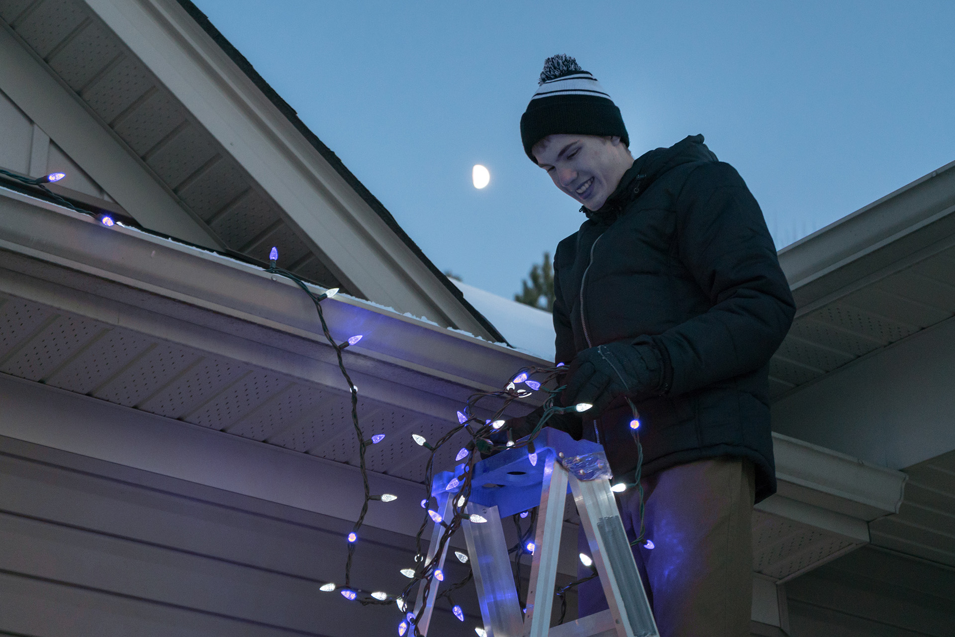 Tenant Installing Christmas Lights